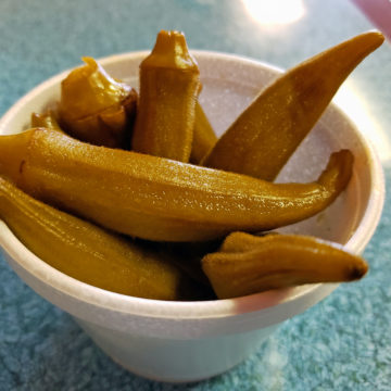 Cup of pickled okra for snacking