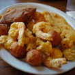 Seafood platter is loaded with fried shrimp, scallops, oysters, flounder, plus deviled crab and hushpuppies