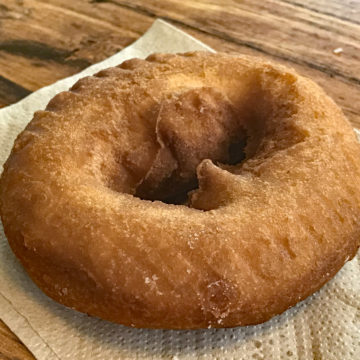 Simple, unfrosted, unsprinkled cake donut, suitable for dunking