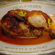 Plated roast chicken in a pool of savory natural juices