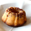 Miniature vanilla bundt cake is served sopped with rum
