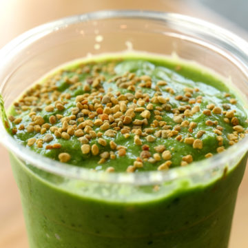 Bright green smoothie includes spinach and bee pollen.
