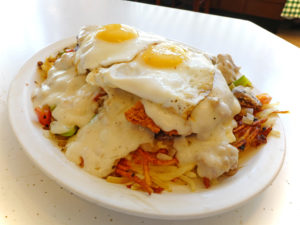 Chicken-fried steak topped with sausage gravy and sunnyside-up eggs ... excellent breakfast