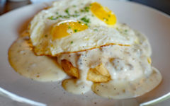 Biscuits and gravy topped with fried eggs ... stylin' breakfast