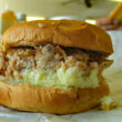 Finely chopped pork and cole slaw piled in a bun