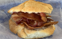 Biscuit sandwiches plenty of bacon.