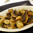 Oblong bowl holds sauteed mushrooms