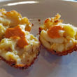 Crisp-edge balls of fried mac & cheese are dolloped with hot pepper sauce