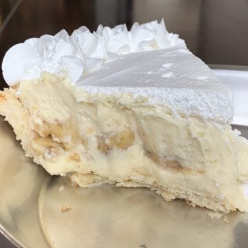 Cream pie slice is packed with bananas
