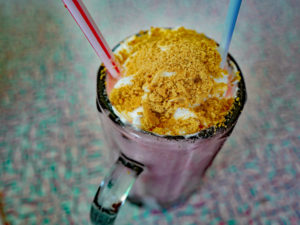 Strawberry shake topped with Graham cracker crumbs ... car hop service