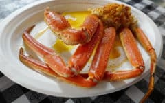 One cluster of crab legs, dripping with butter