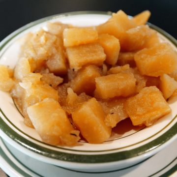 Soft chunks of rutabaga in a green-rimmed diner bowl