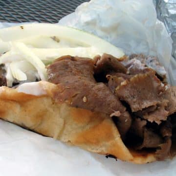 Pita bread wraps gyro meat and onions