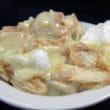 Custard, sliced bananas, crumbled Nilla wafers, and meringue are crowded in a diner bowl