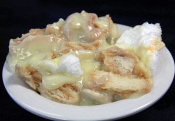 Custard, sliced bananas, crumbled Nilla wafers, and meringue are crowded in a diner bowl