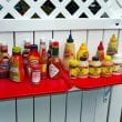 Condiment array at an al fresco hot dog stand