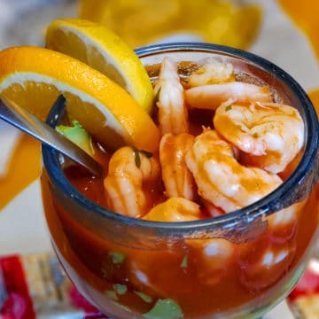 Mexican shrimp cocktail is a crowd of shrimp along with slivers of avocado in pepper-hot sauce.