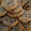 A great pile of dark brown cookies loaded with chocoate chips