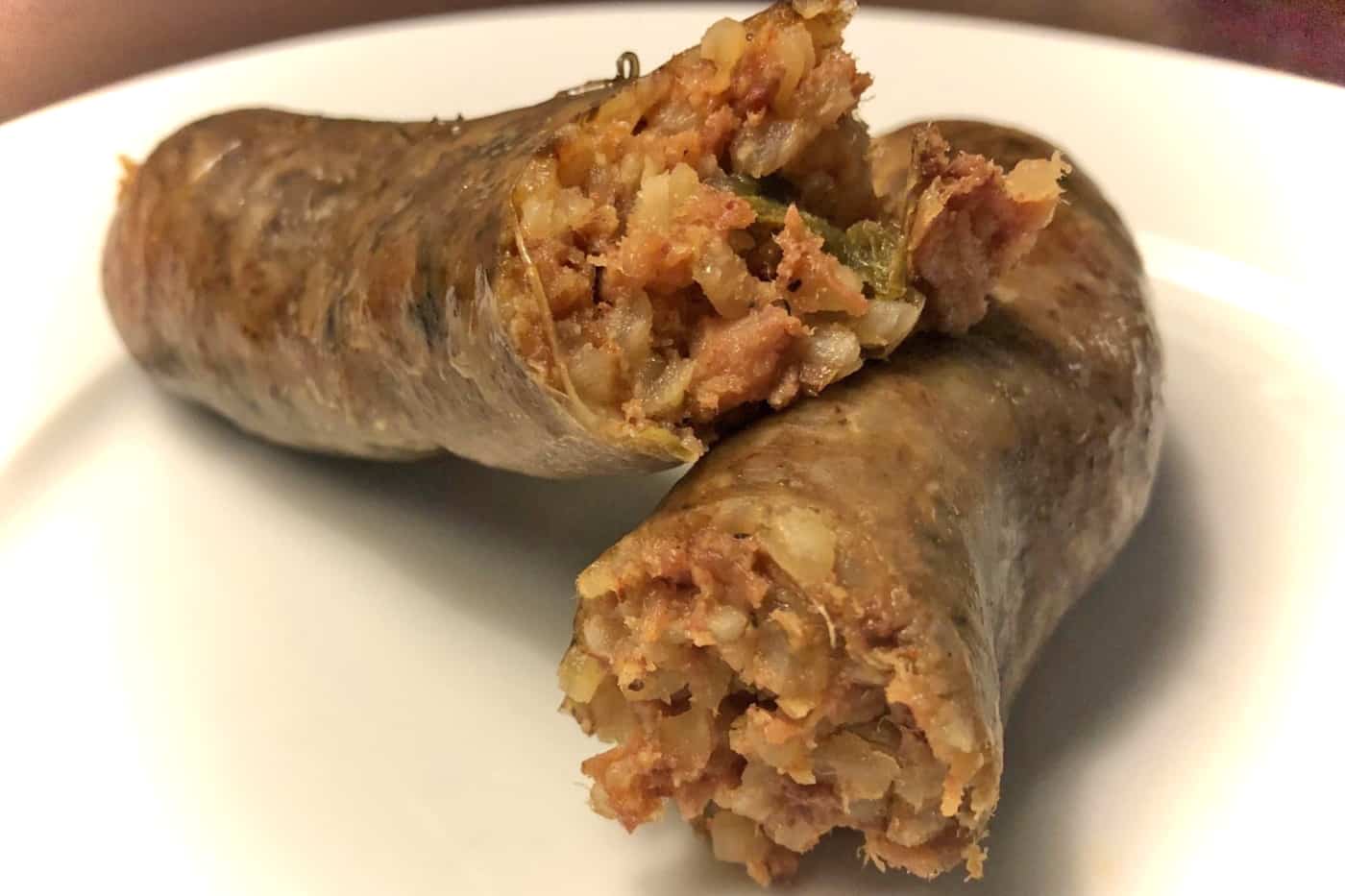 Rugged mix of meat, rice, and spice inside a smoked boudin link
