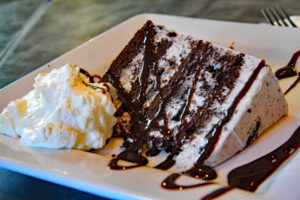 slice of oreo cake with fresh whipped cream ... New Bedford seafood